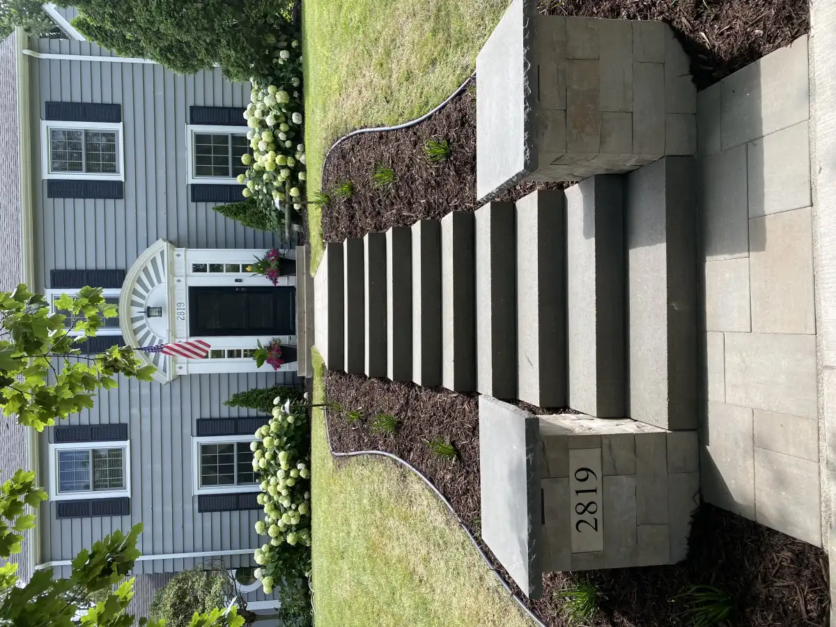 Side yard after transformation with patio and fire feature