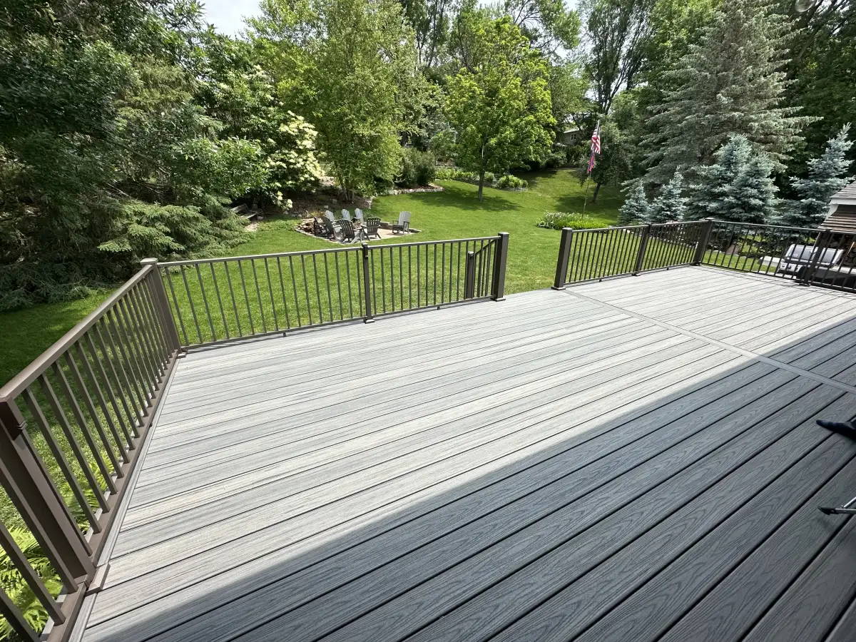 Composite deck with cable railing and built-in bench seating