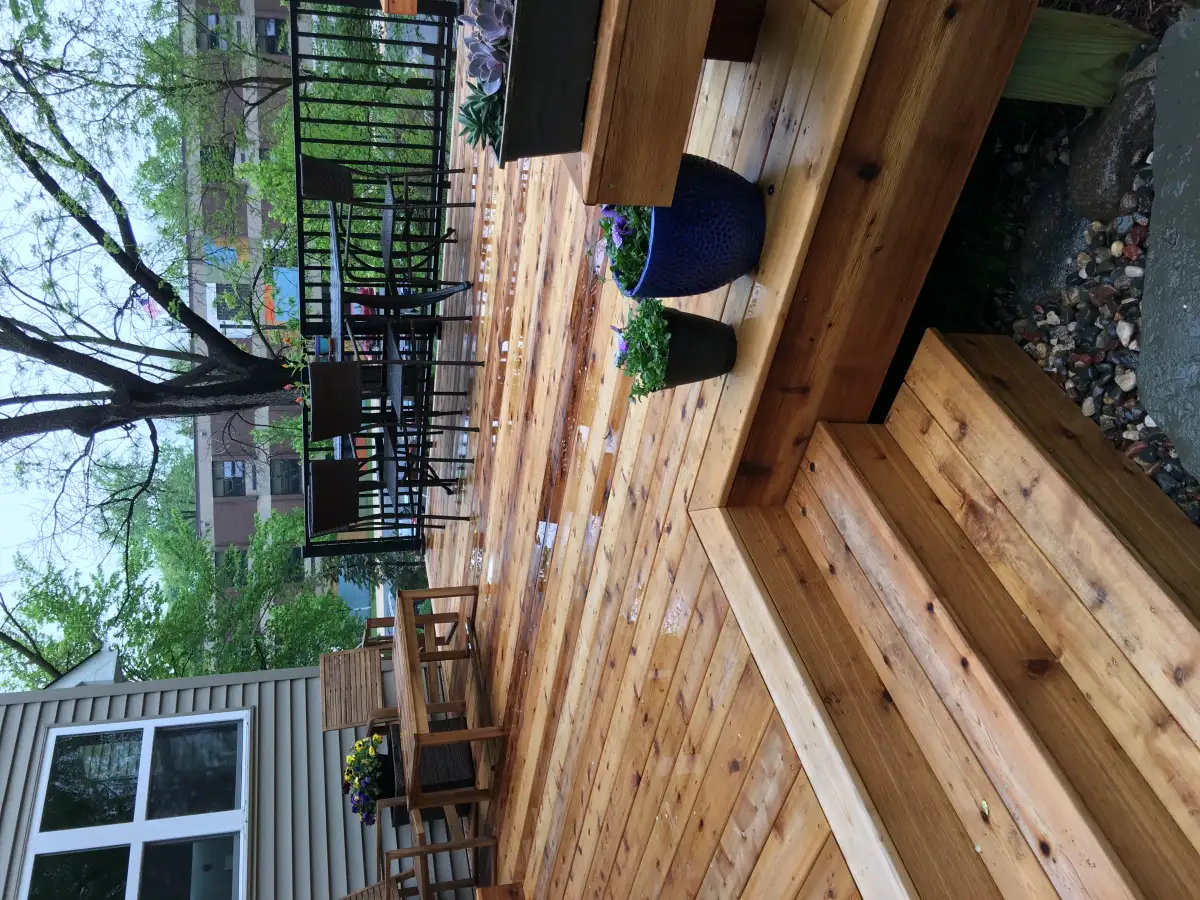 Multi-level deck with stairs leading to patio in Minnetonka