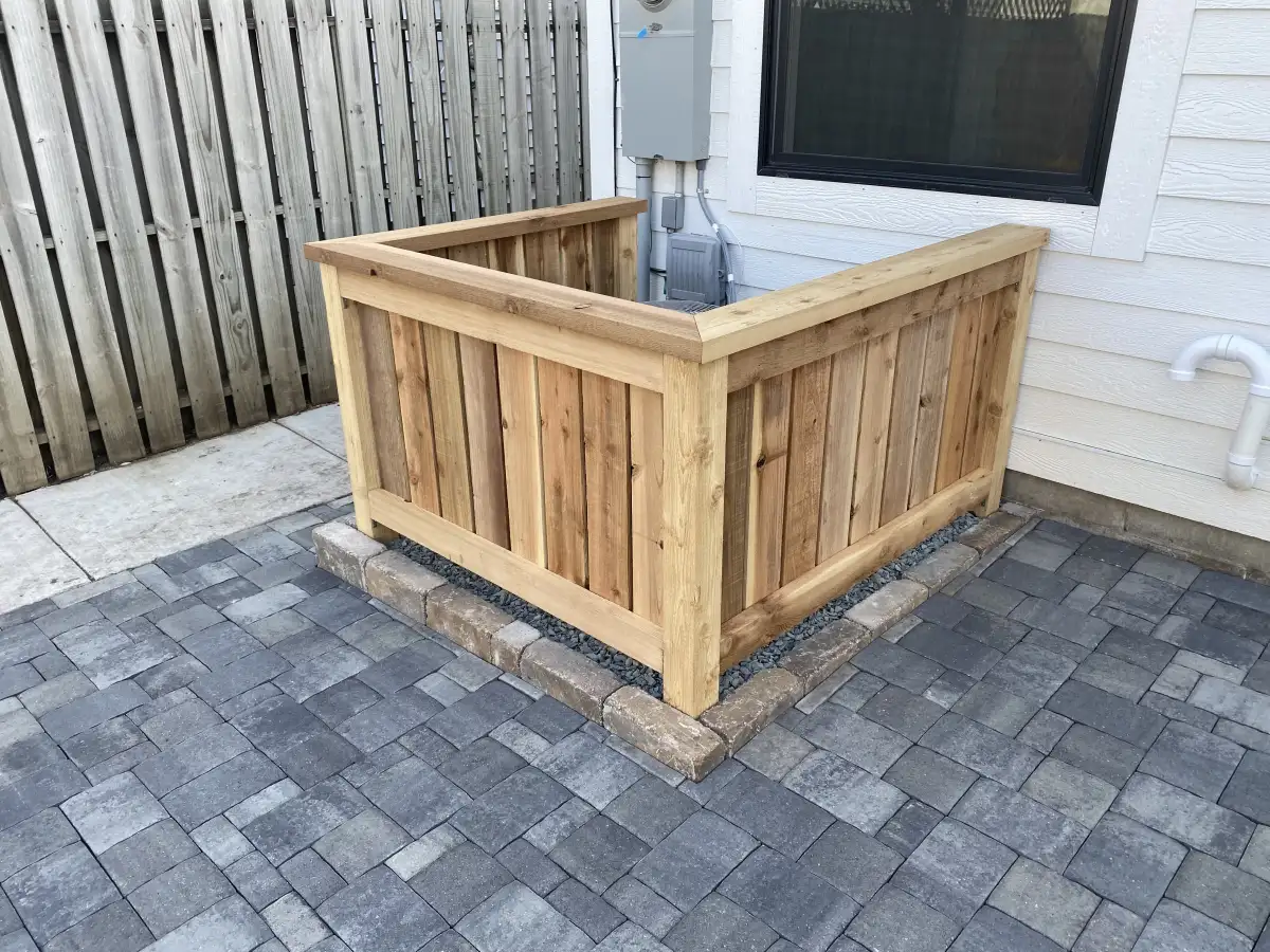 Fence line garden with layered planting design in Wayzata