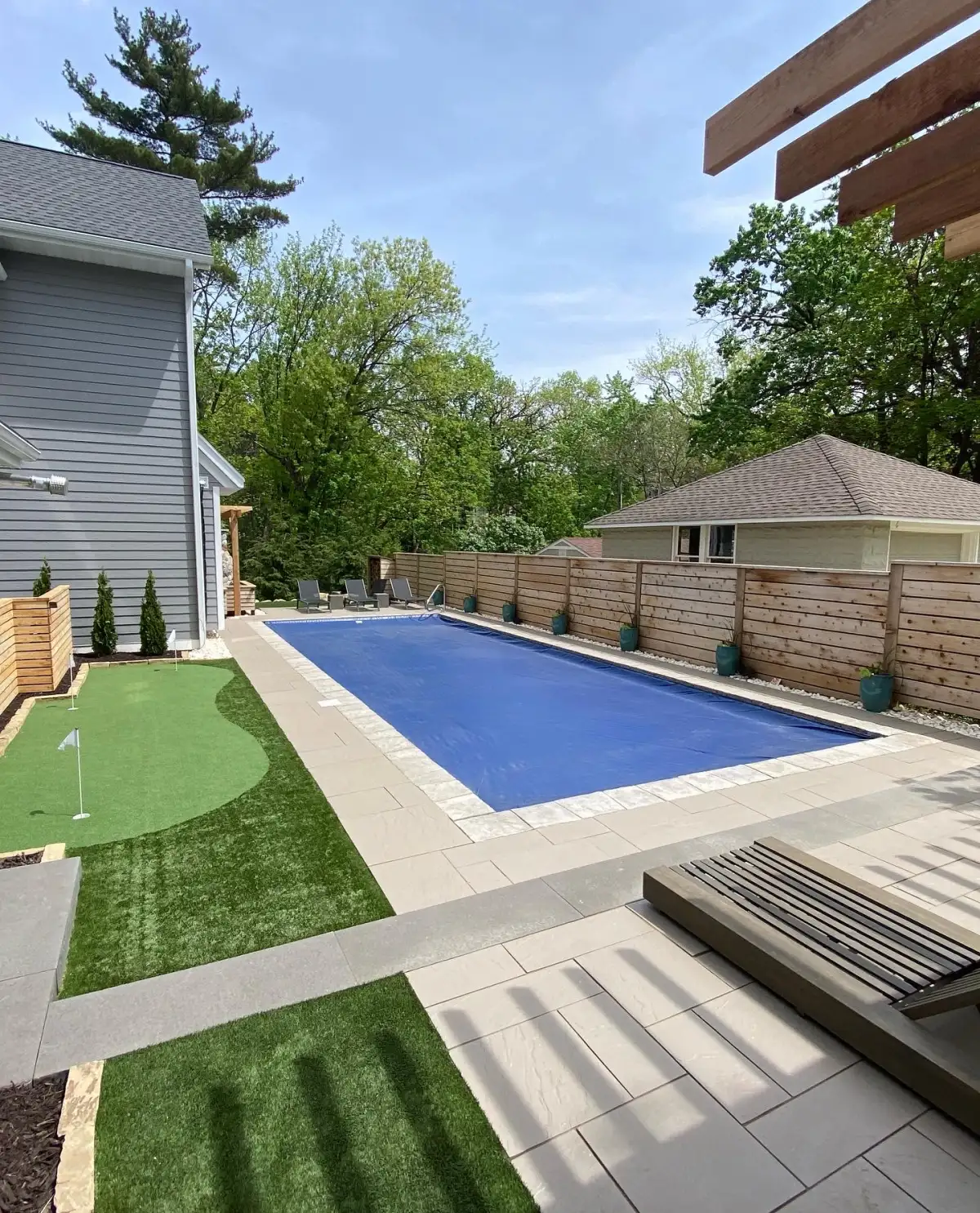 Garden bed with perennial plantings along fence in Shorewood MN