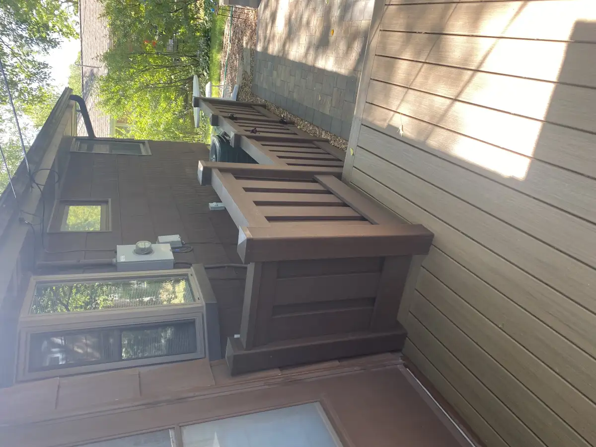 Decorative fence with integrated planter boxes and greenery