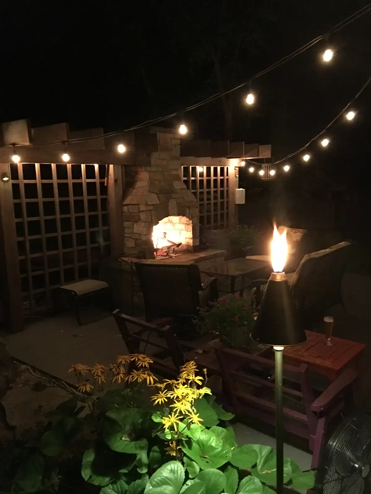 Integrated step lighting and accent wall lights at evening