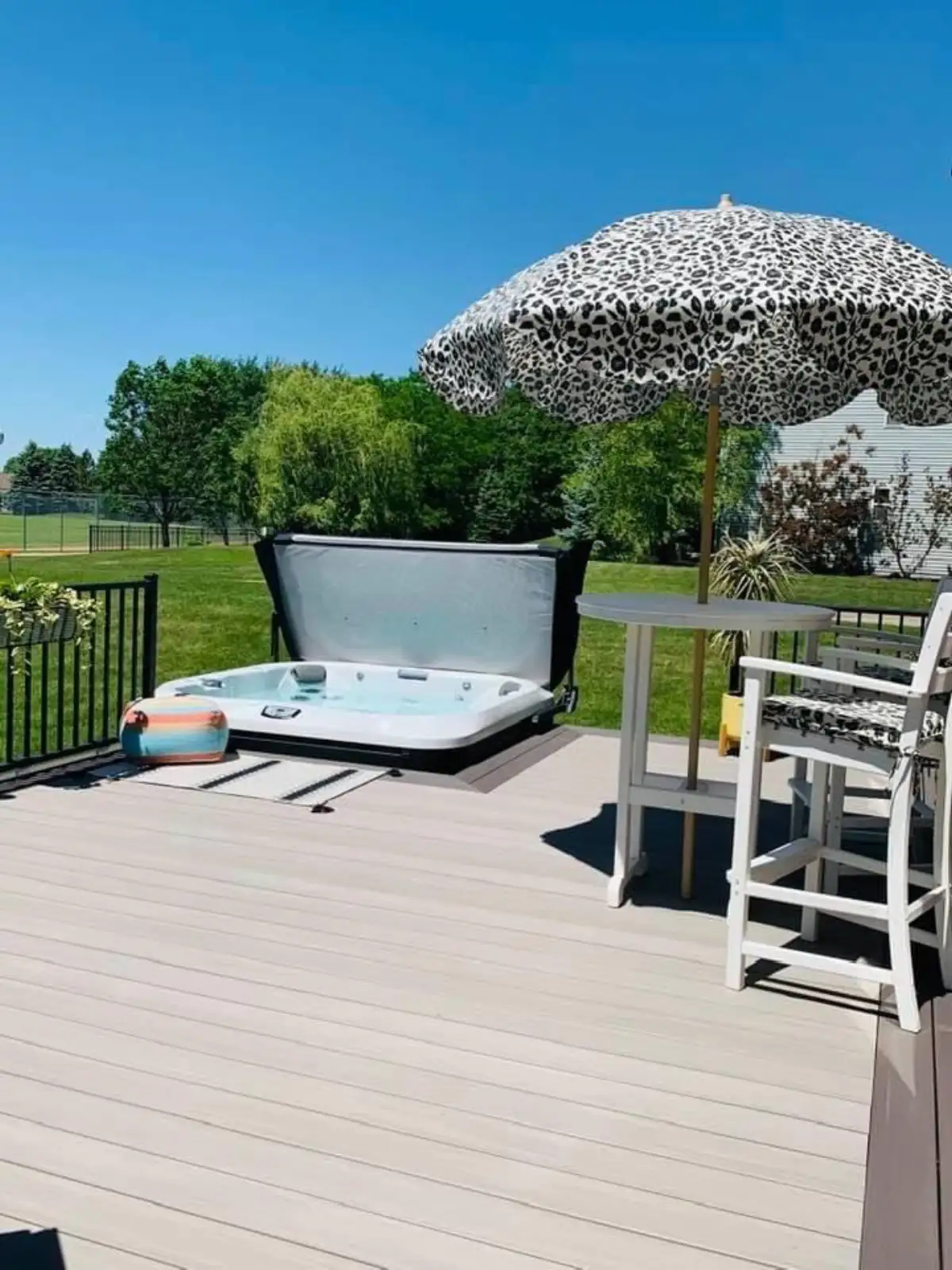 Premium outdoor living transformation with lighting at dusk