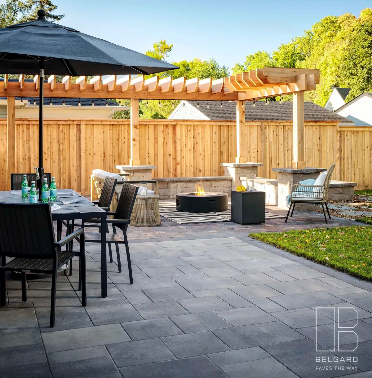 Four-season outdoor living space with retaining wall backdrop