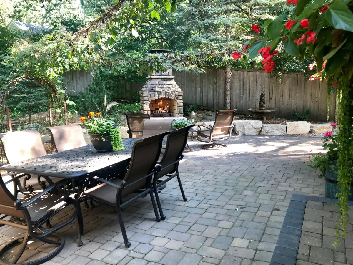Multi-zone outdoor entertainment area with fire feature and dining