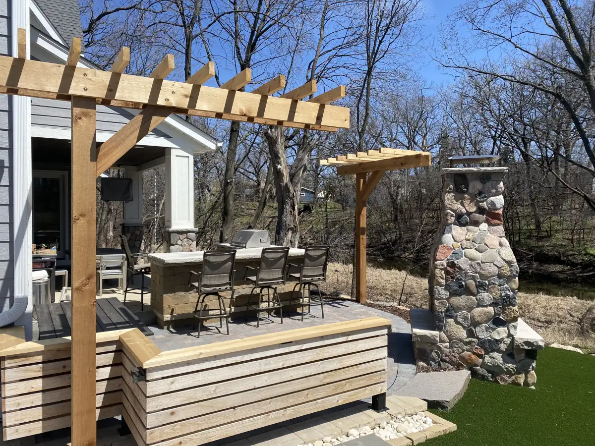 Outdoor entertaining area with fire pit and seating in Minnetonka
