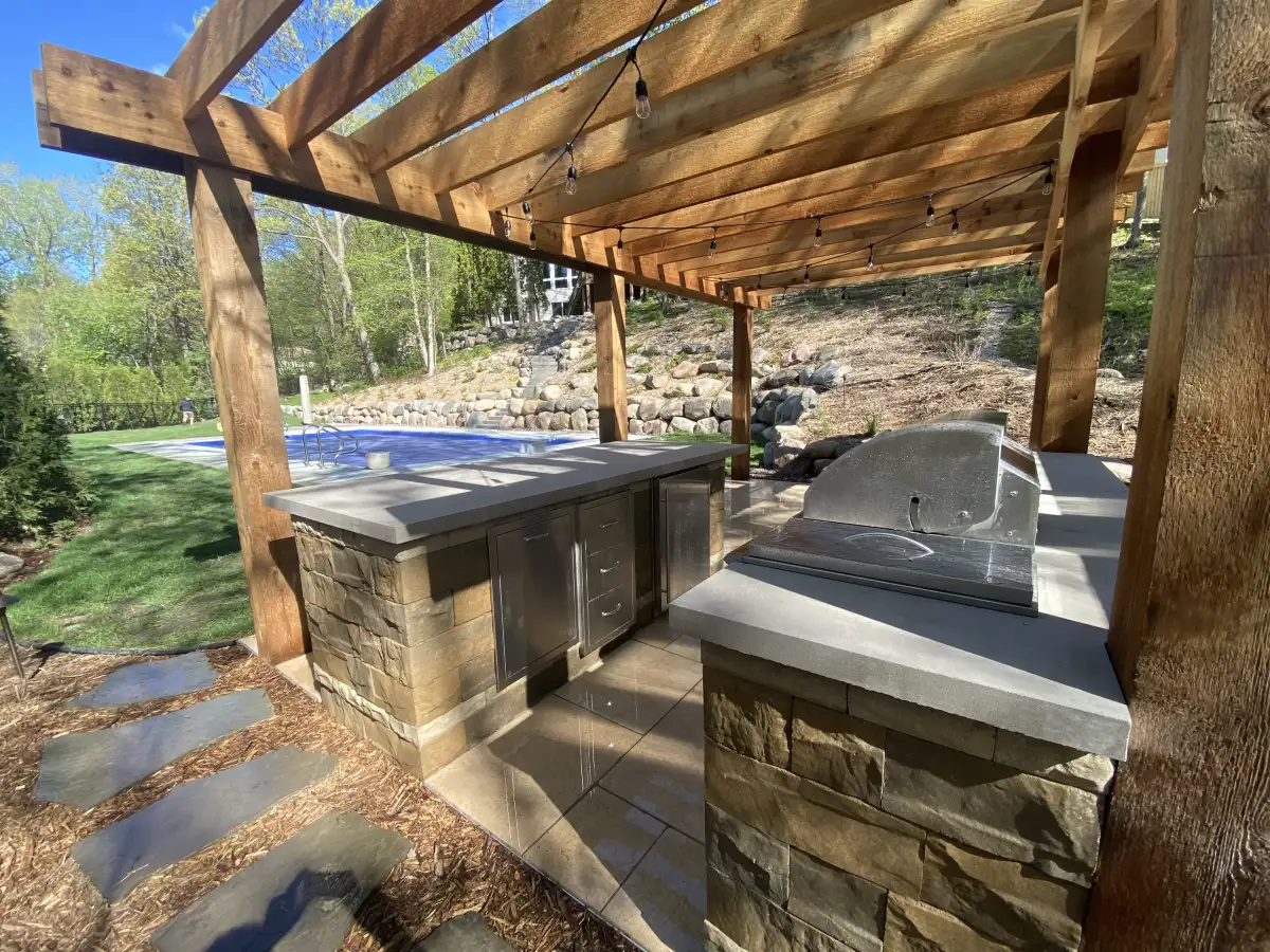 Backyard outdoor living transformation with covered dining area