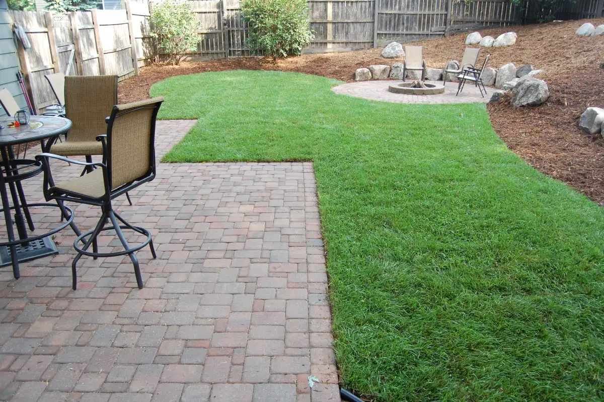 Custom paver patio installation with herringbone pattern in Minneapolis area