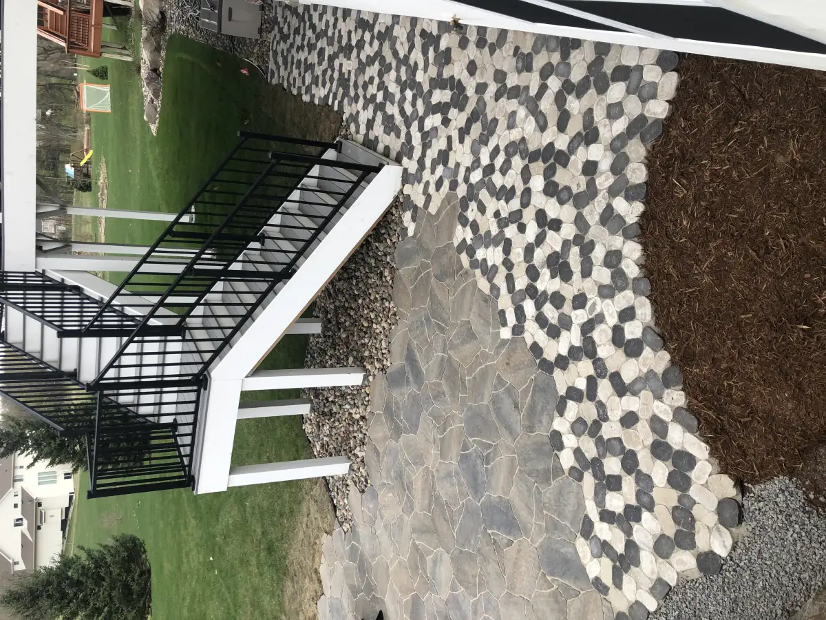 Large-format paver patio with outdoor dining space