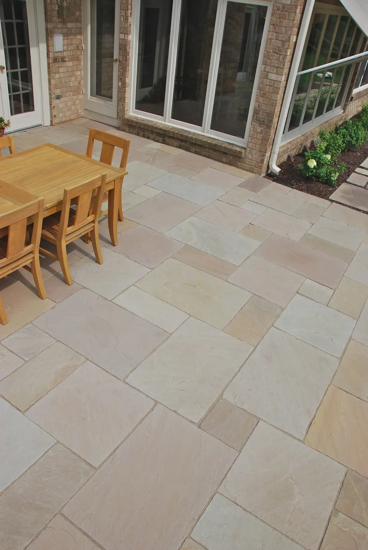 Premium paver patio with raised planter beds and walkway