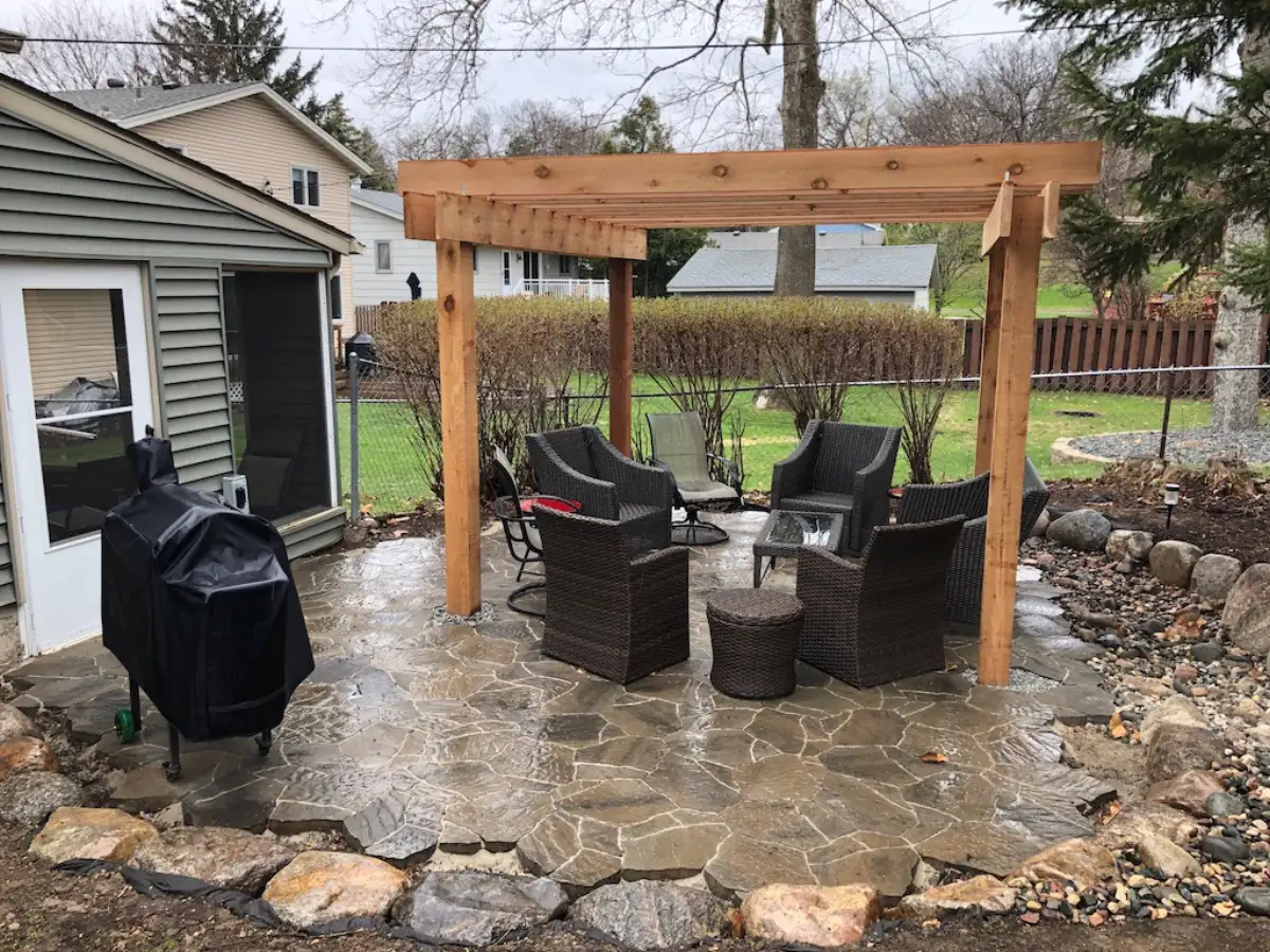 Pergola with landscape lighting at dusk