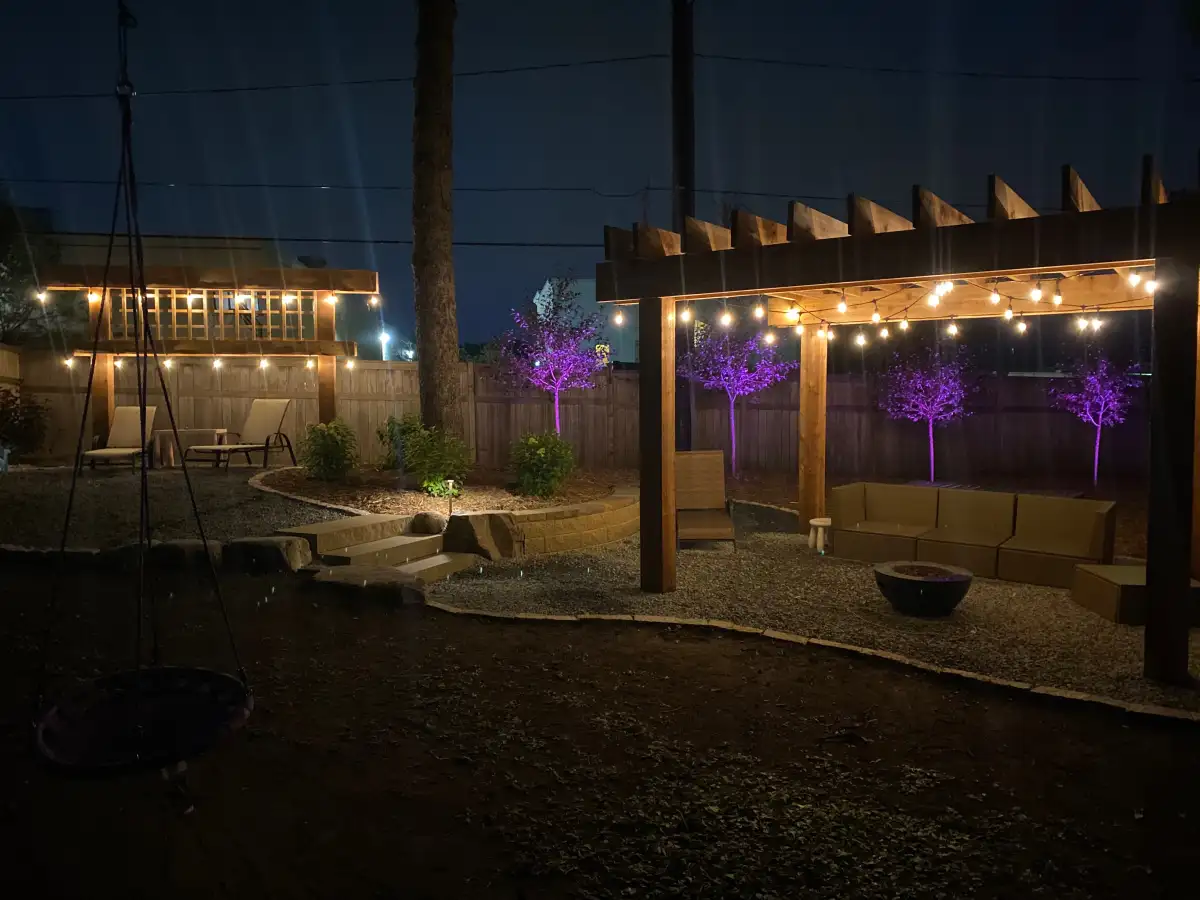 Pergola with string lighting over dining area in Shorewood