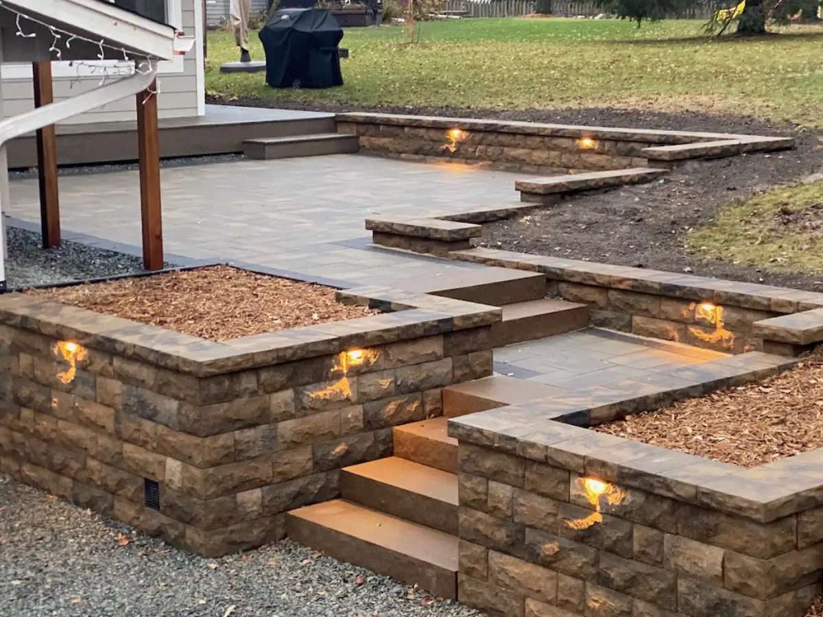 Multi-tiered retaining wall creating usable yard space