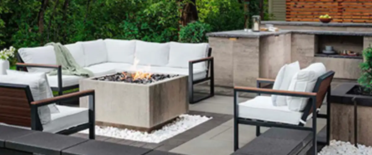 Outdoor living space with patio, fire feature, and landscape lighting in Minnetonka