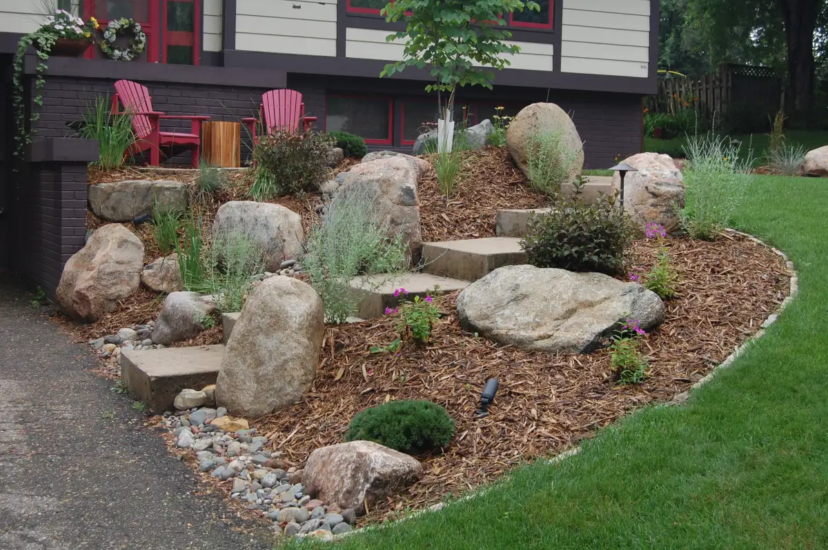 Front entrance stone steps with landscape lighting in Minnetonka