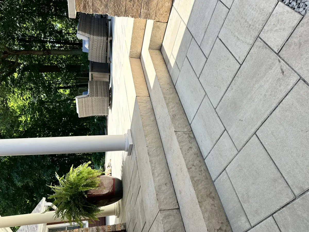 Wide paver steps with cheek walls and integrated riser lights