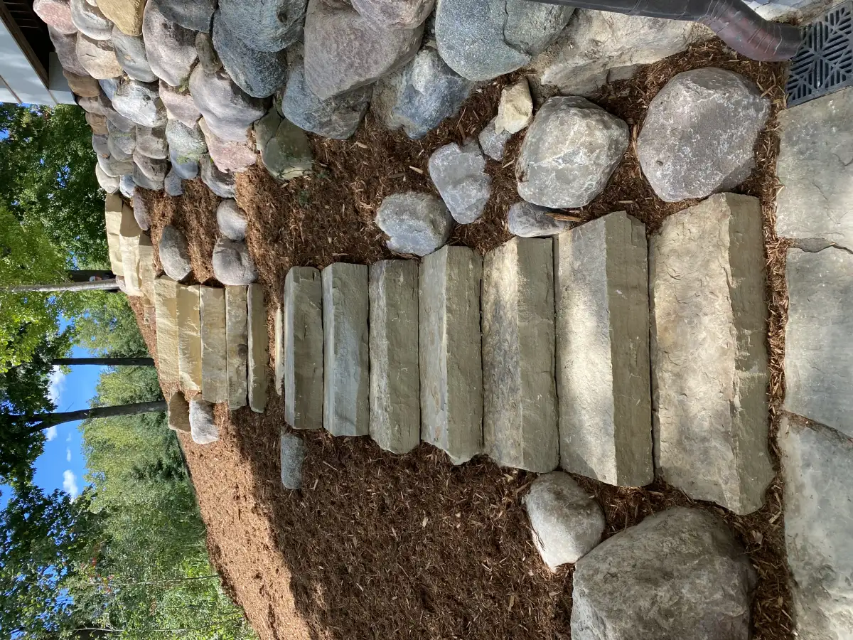 Wide entrance steps with boulder accents near Lake Minnetonka