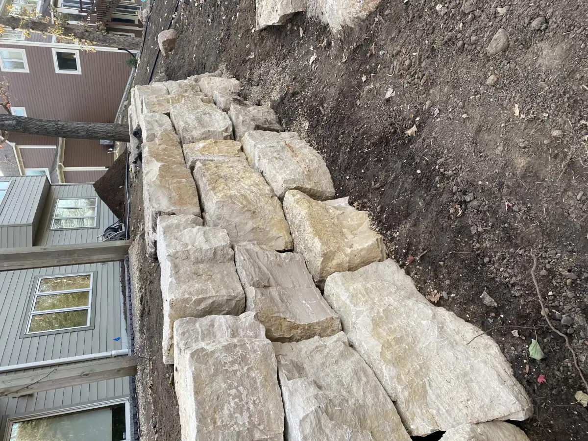 Boulder retaining wall on hillside near Lake Minnetonka