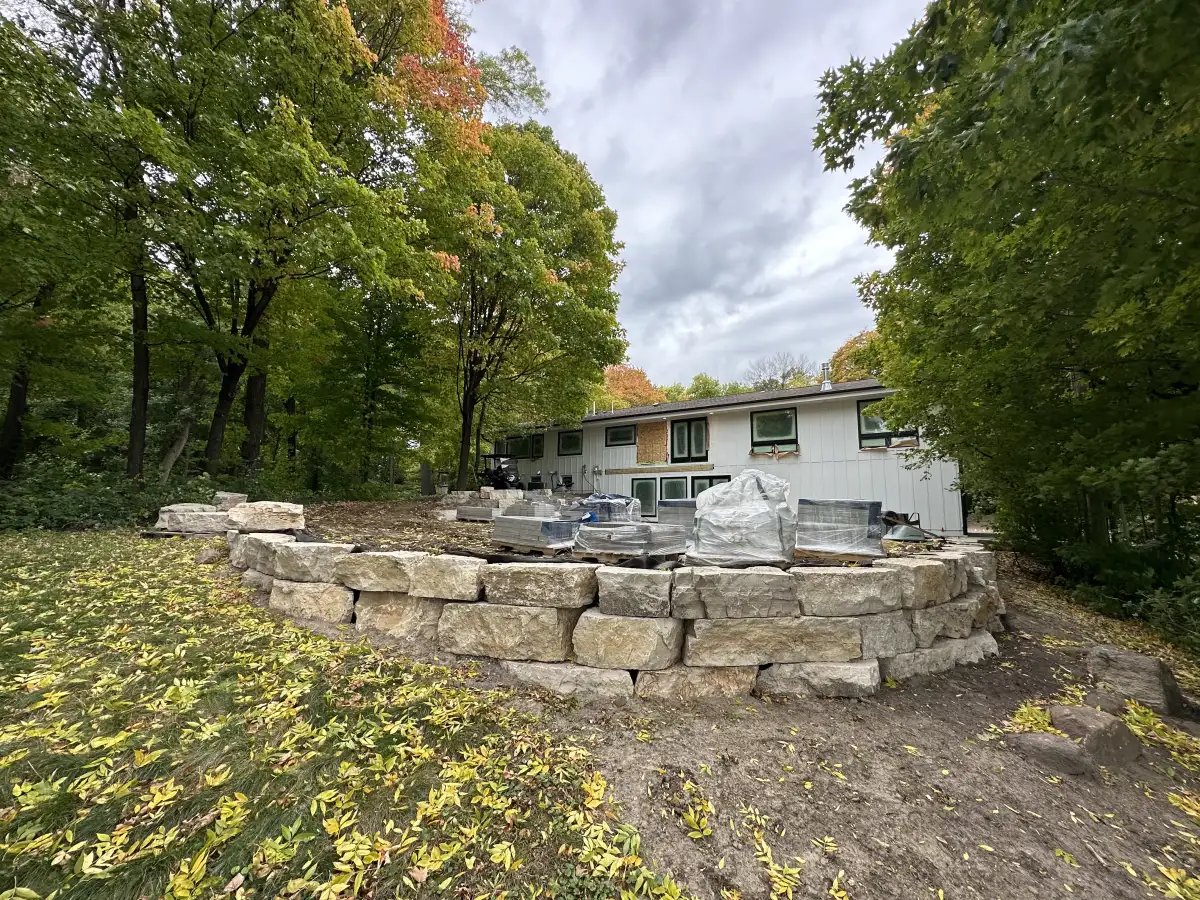 Multi-tiered retaining wall system creating usable yard space