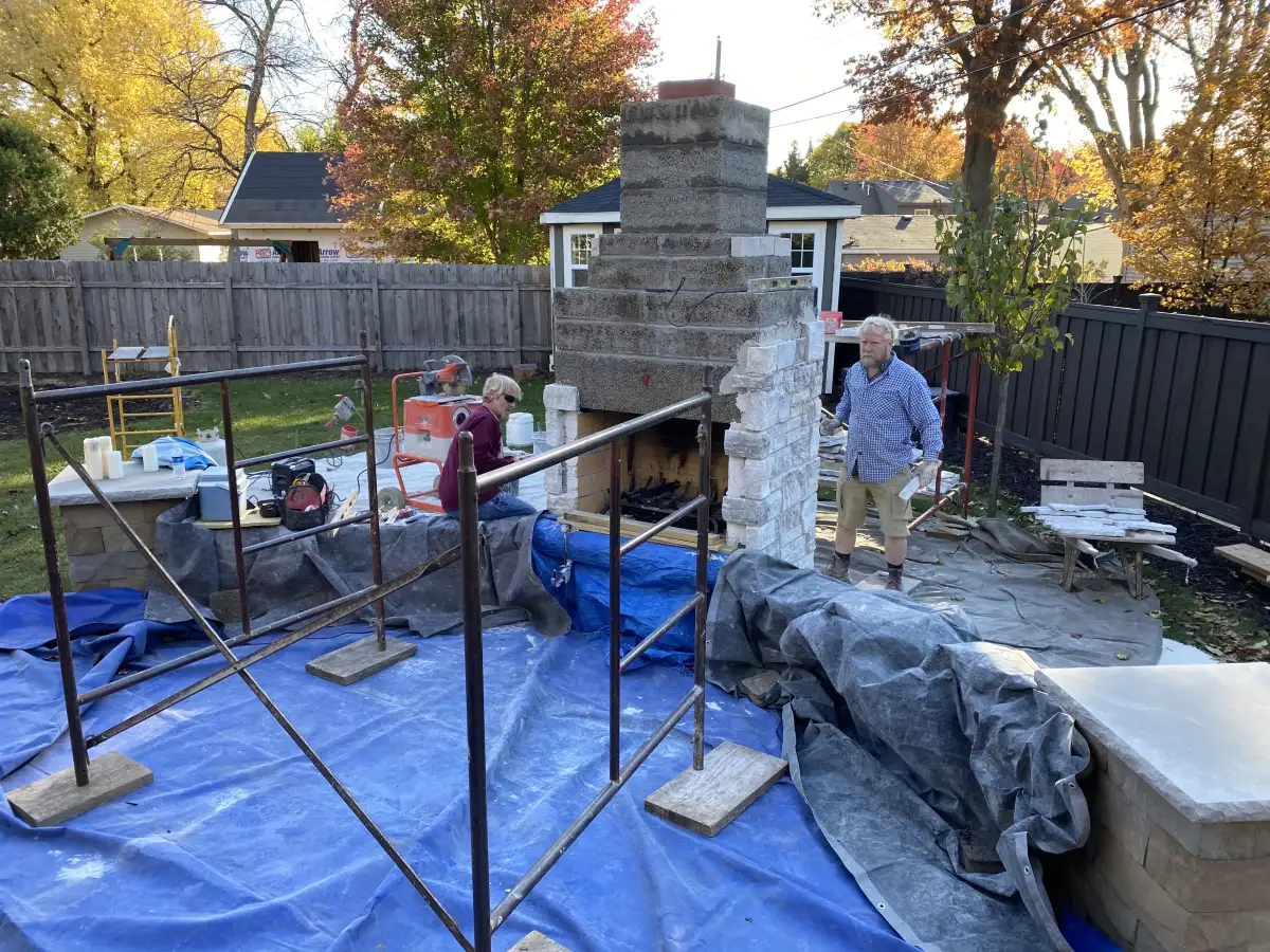 Retaining wall construction in progress by Landscape Charlie crew